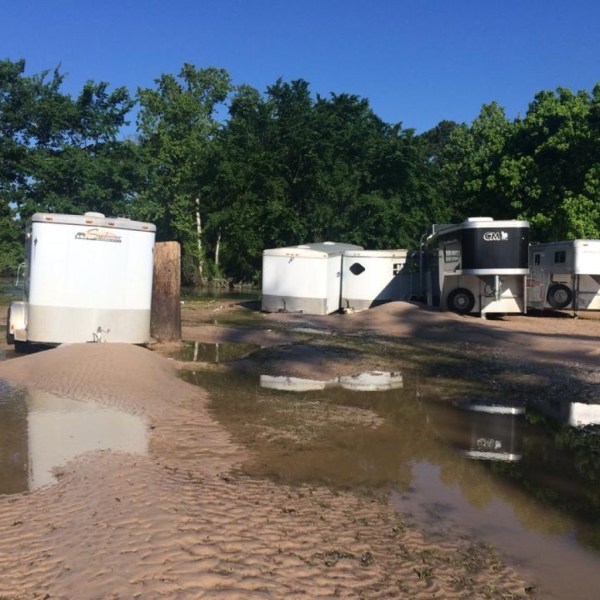 a truck driving down a dirt road