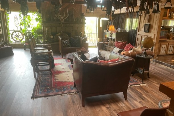 a living room filled with furniture and a fire place