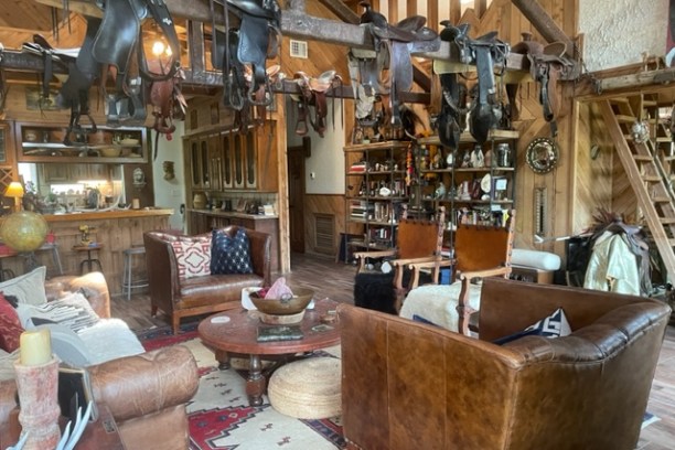 a living room filled with furniture and a fire place