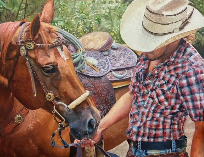 Man in cowboy hat with horse, holding reins, wearing plaid shirt, standing beside saddled horse.